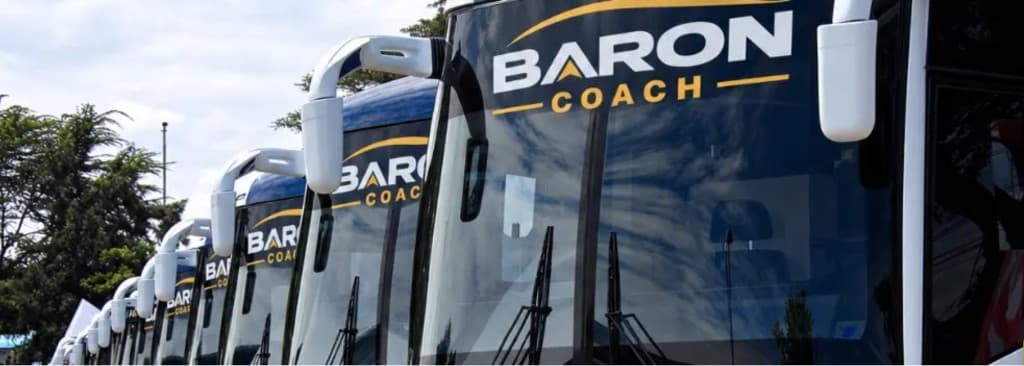 Baron Coach buses lined up with BARON COACH on the windscreens.